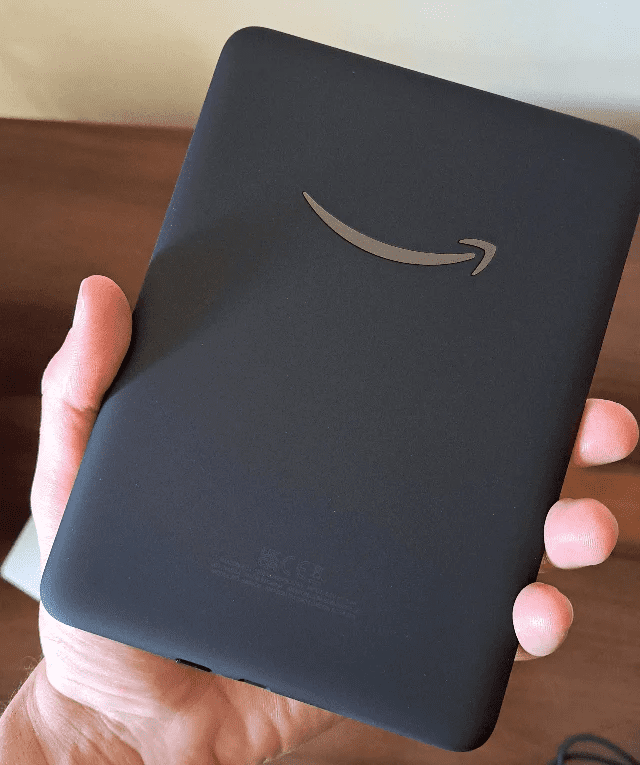 Kindle Colorsoft: features a rubberized textured finish and the Amazon smile on the back.
